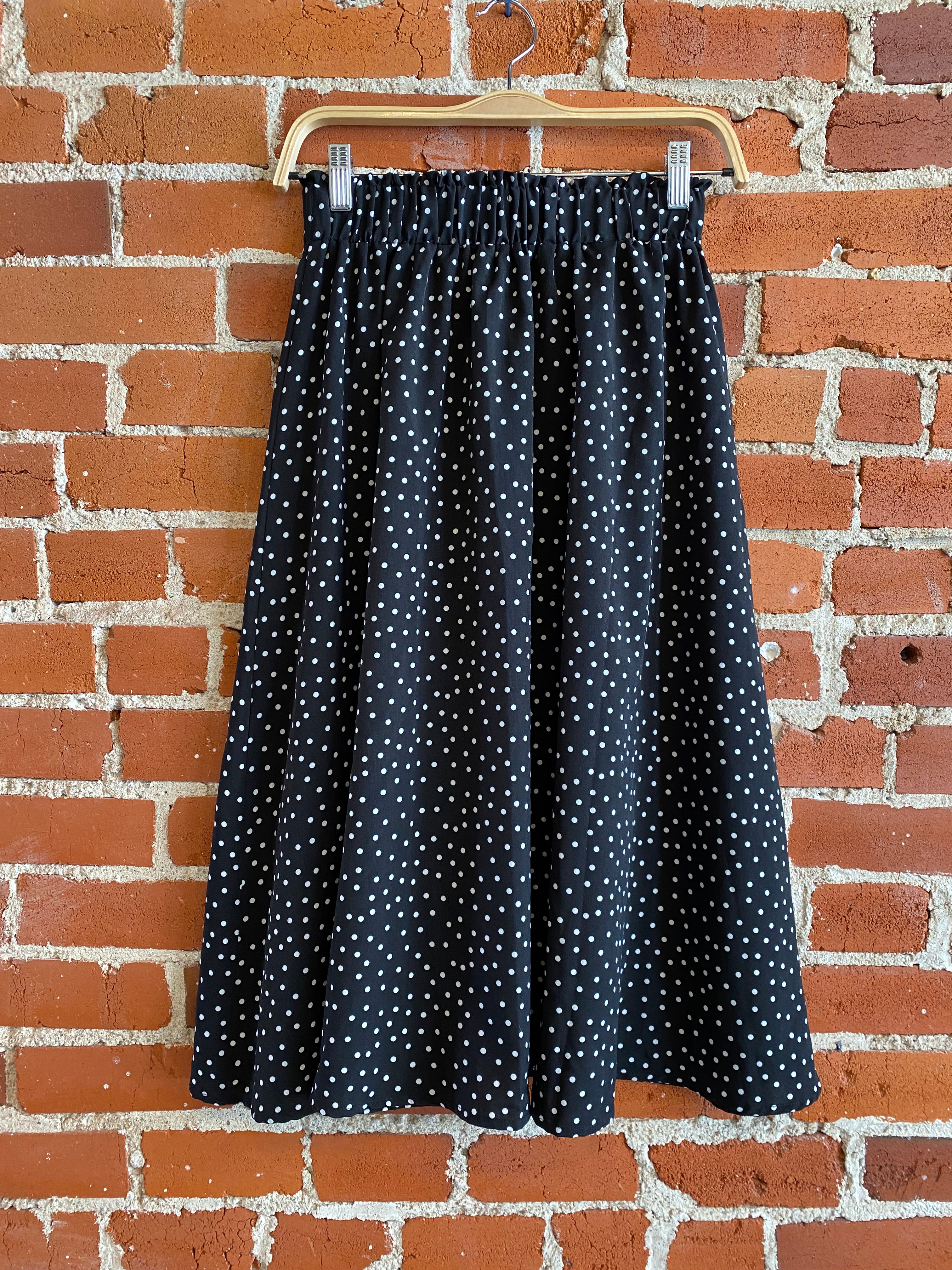 
  
  Black and white polka dot midi skirt
  
